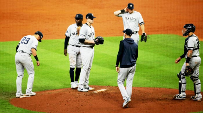 Oct 13, 2019; Houston, TX, USA; New York Yankees starting pitcher James Paxton (65) is removed from the game by manager Aaron Boone (17) during the third inning in game two of the 2019 ALCS playoff baseball series against the Houston Astros at Minute Maid Park. Mandatory Credit: Troy Taormina-USA TODAY Sports